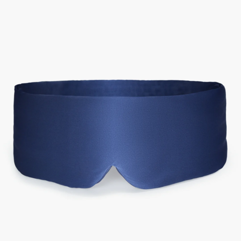 Navy blue sleep mask with a smooth texture, designed for comfort and light blocking.