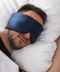Man peacefully sleeping with deep sleep mask