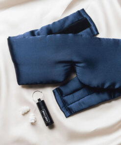 Mask and earplugs placed on a bed 2