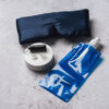Mask, earplugs on a stand and bottle bundle
