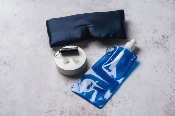 Mask, earplugs on a stand and bottle bundle