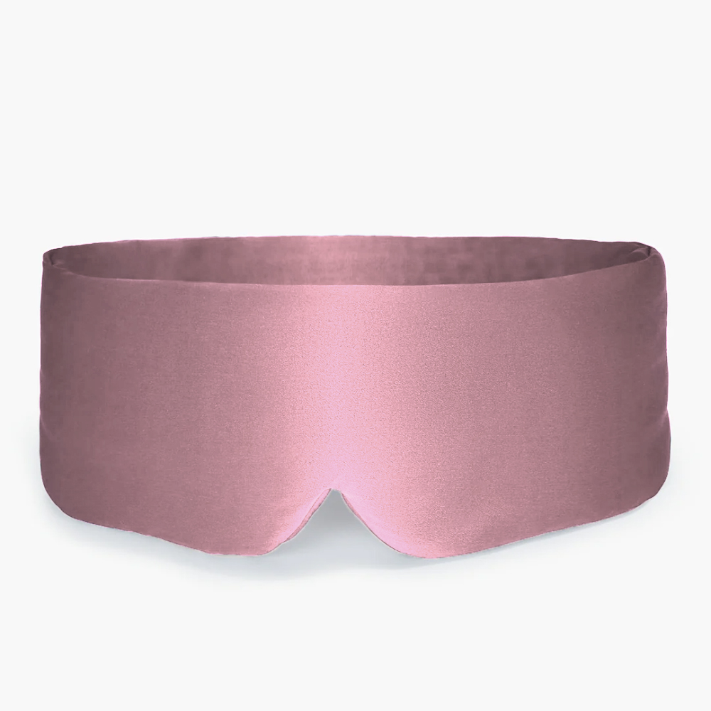 Pink satin sleep mask with a smooth surface and rounded edges.