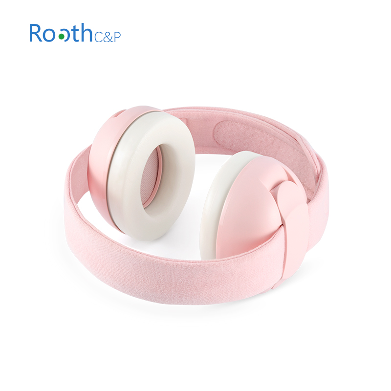 Light pink headphones with white ear cups and a soft fabric headband.
