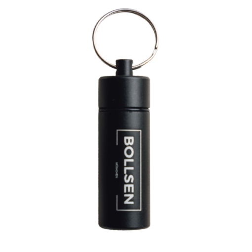 Black cylindrical keychain holder with a silver keyring and white branding.